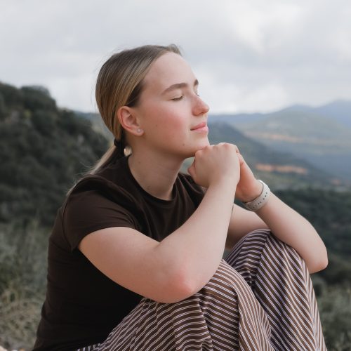 woman in the mountains, embracing slow living and mindfulness. A moment of balance, self-care,
